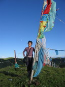 Jane (,China tour consultant) is tring to keep balance on bamboo raft(click to enlarge)