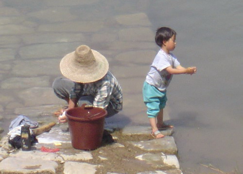 washing clothes in Li River, Yangshuo